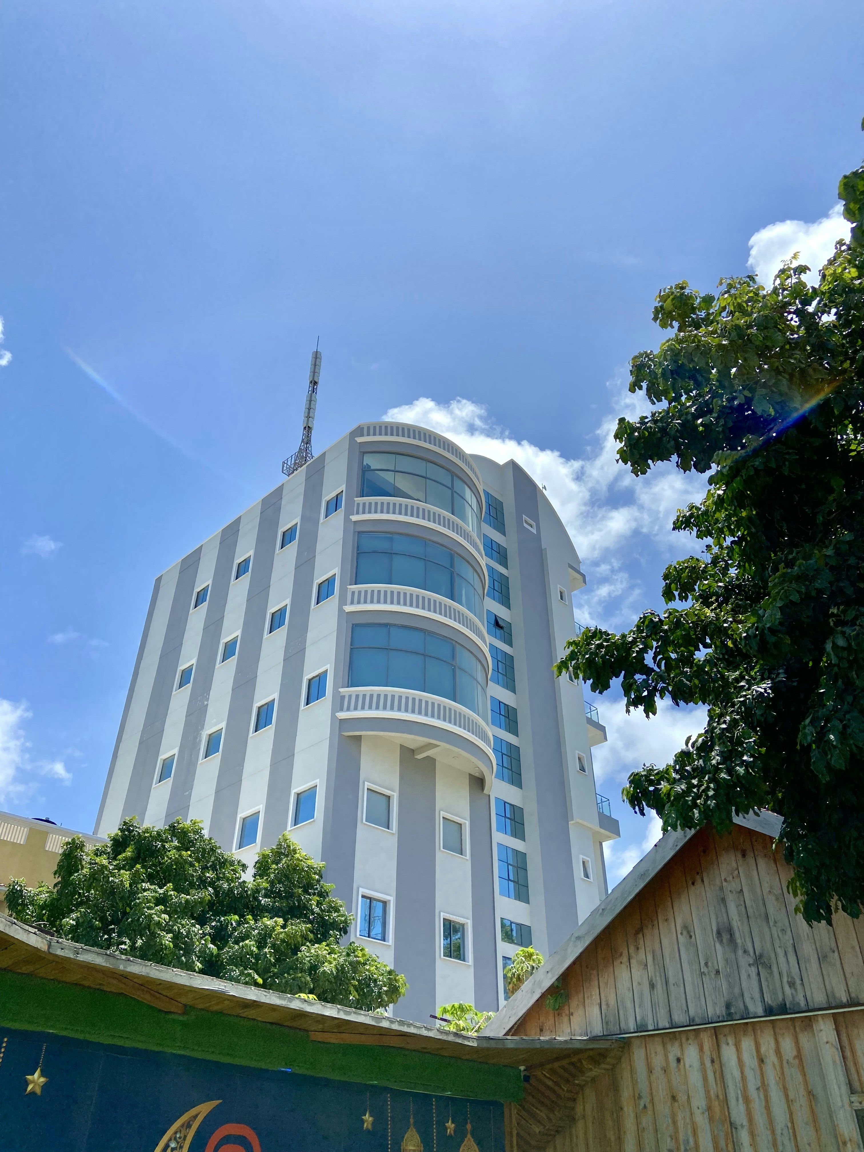 a tall building with a tree in front of it