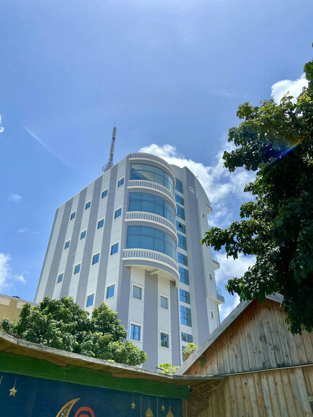 a tall building with a tree in front of it