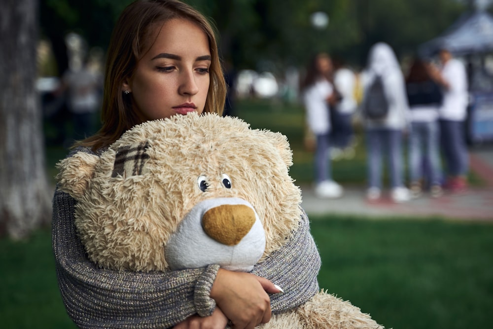 a person holding a stuffed animal