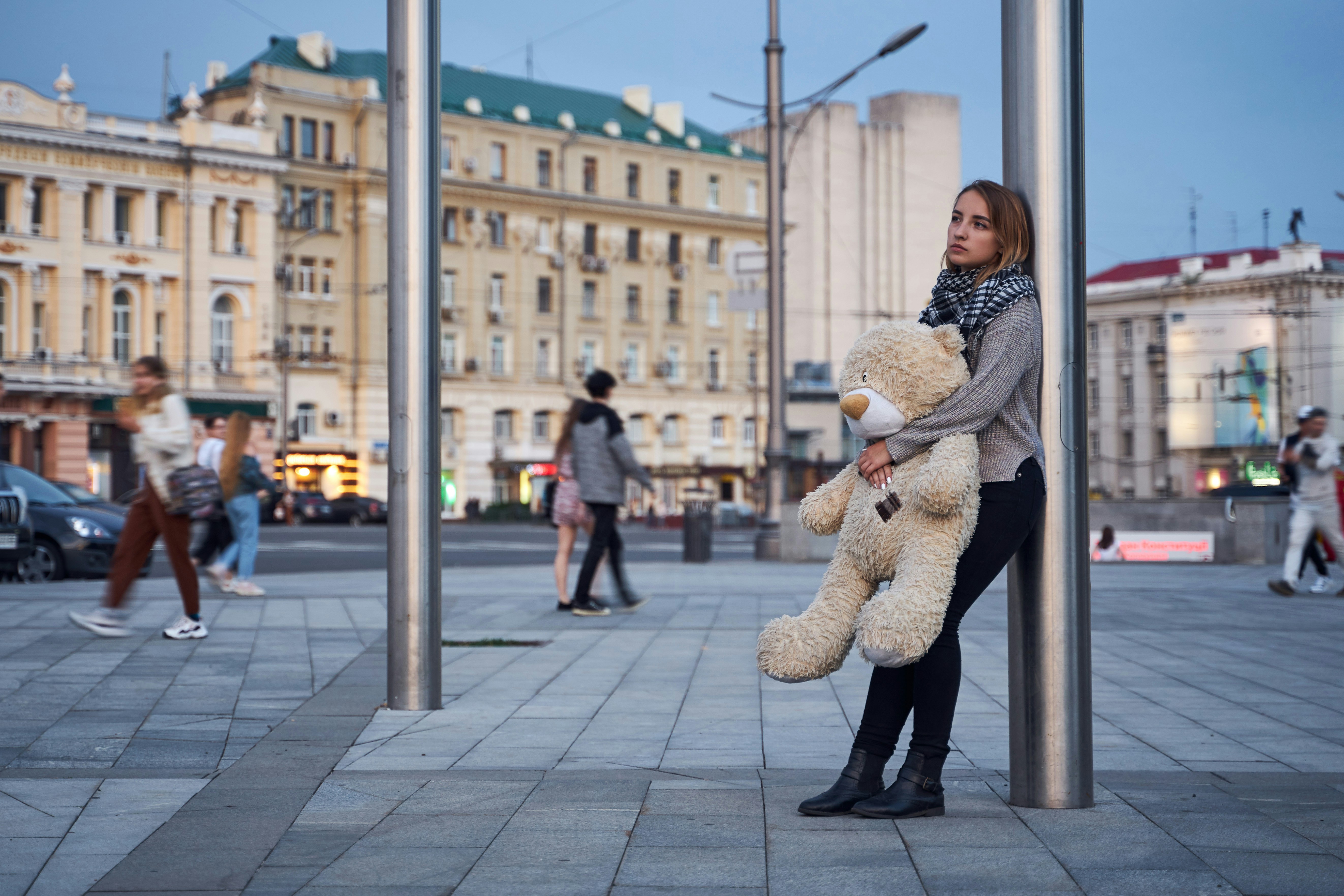 a person holding a large statue