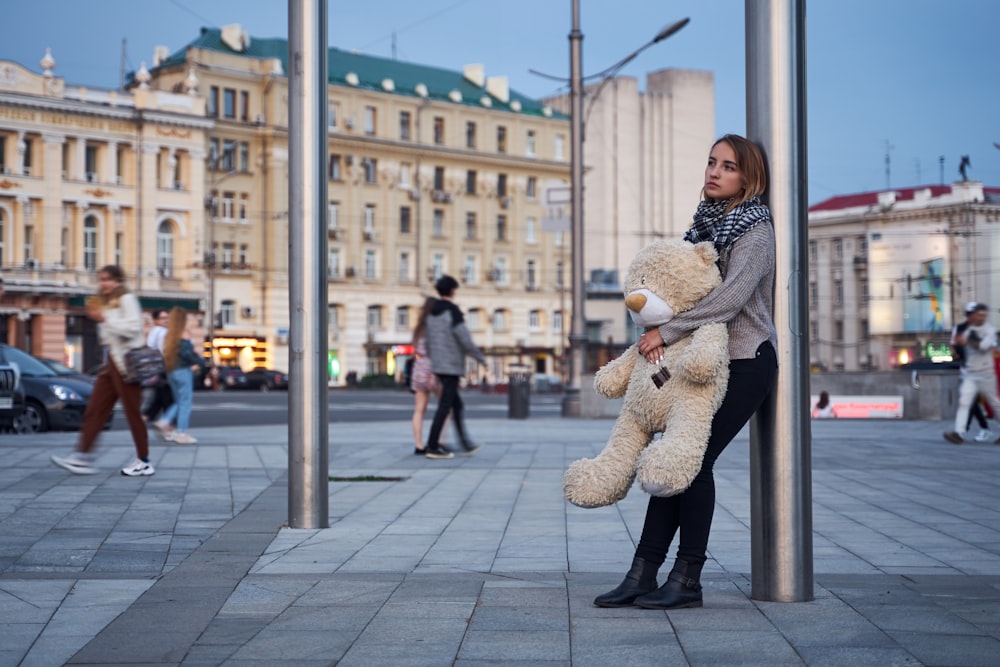 a person holding a large statue