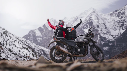 Rider on motorcycle in mountain terrain