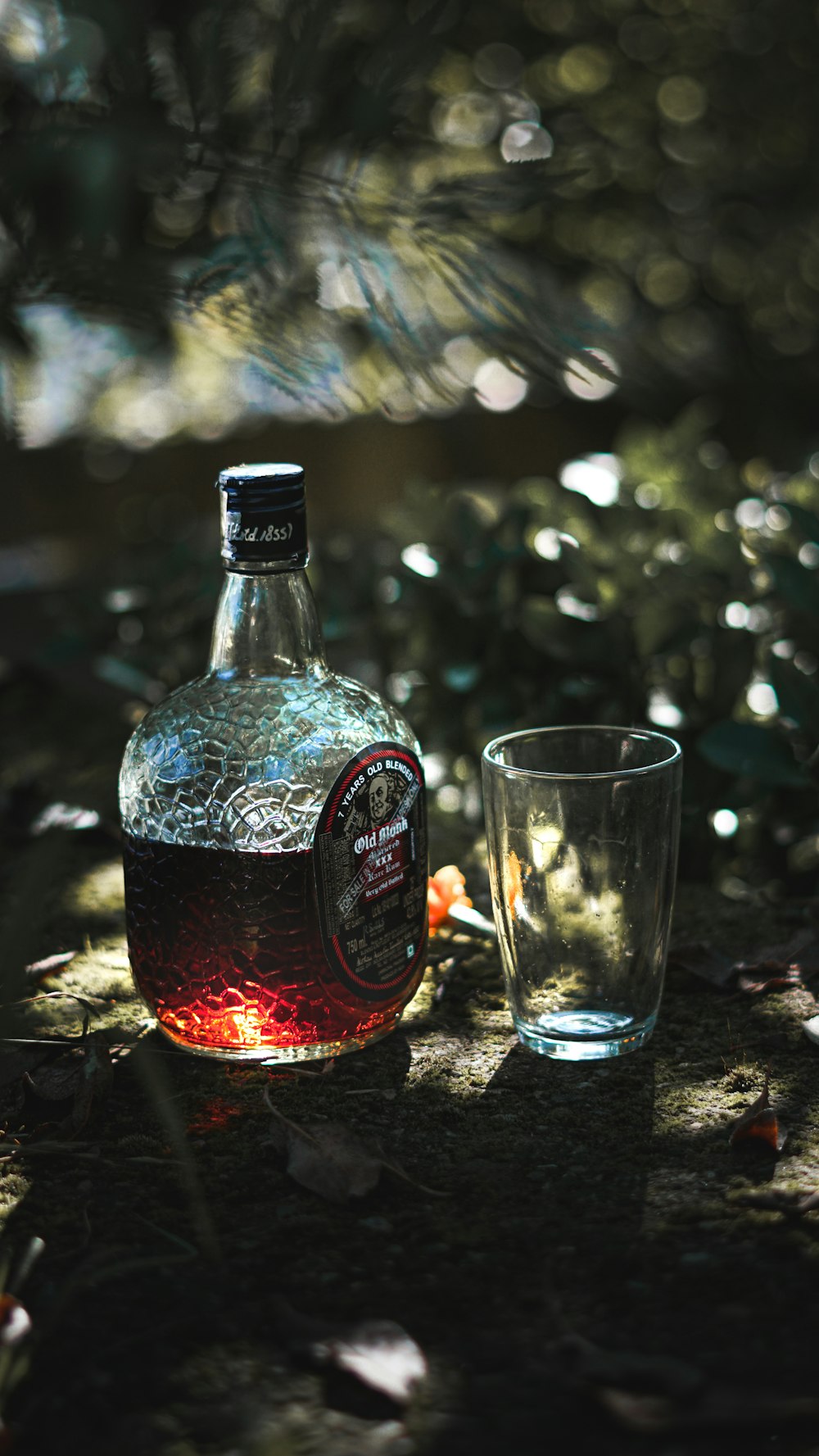 a bottle and a glass on a table