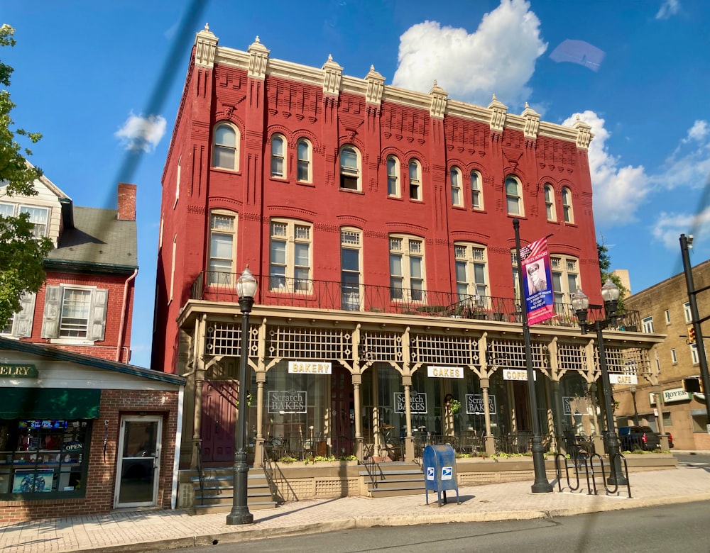 a red building with a flag in front of it