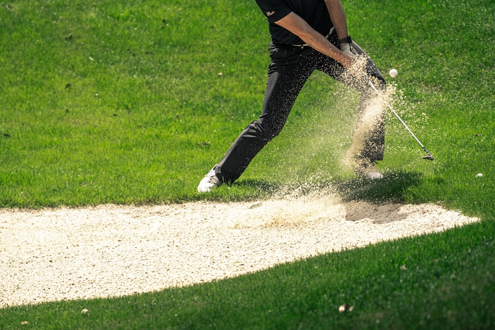 a man swinging a golf club