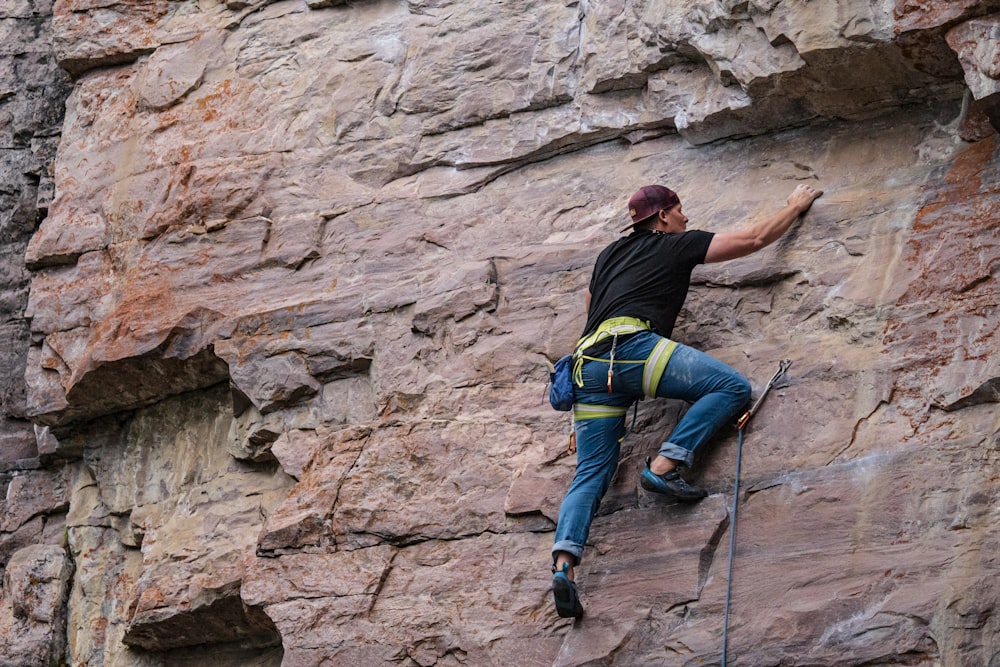 a man climbing a rock wall