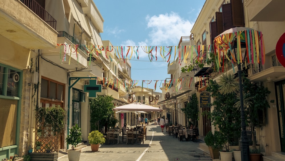 a street with buildings and plants