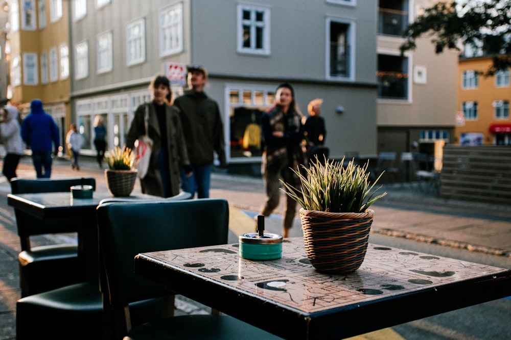 a group of people walking on a sidewalk