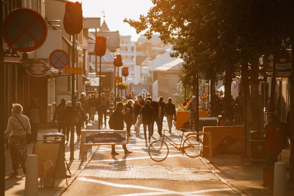 a group of people walking down a street