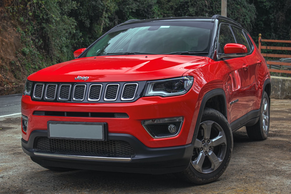 a red car parked on a road