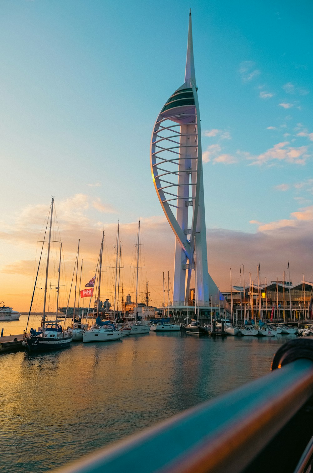 a tall building with many boats in the water