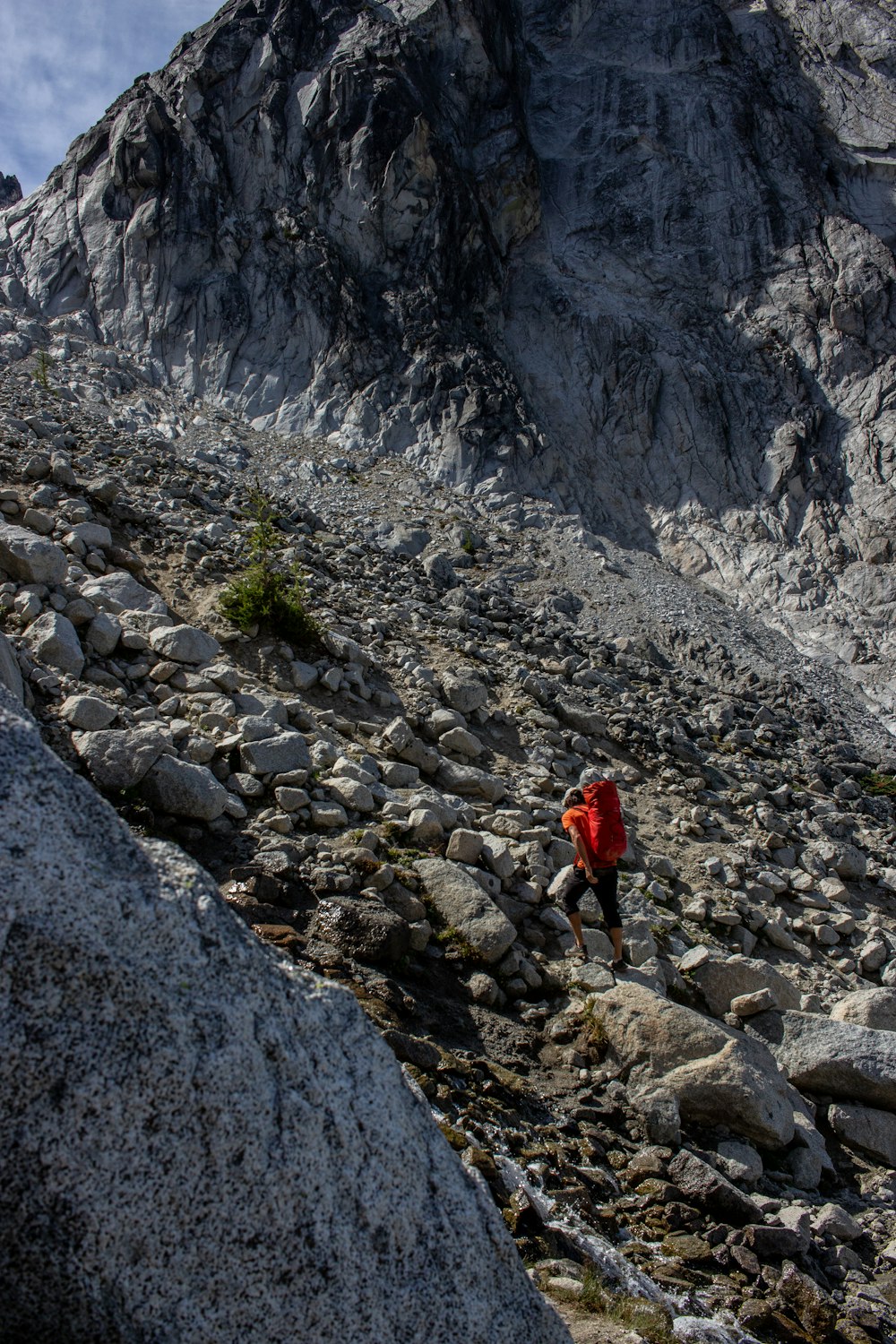 a person walking on a rocky terrain