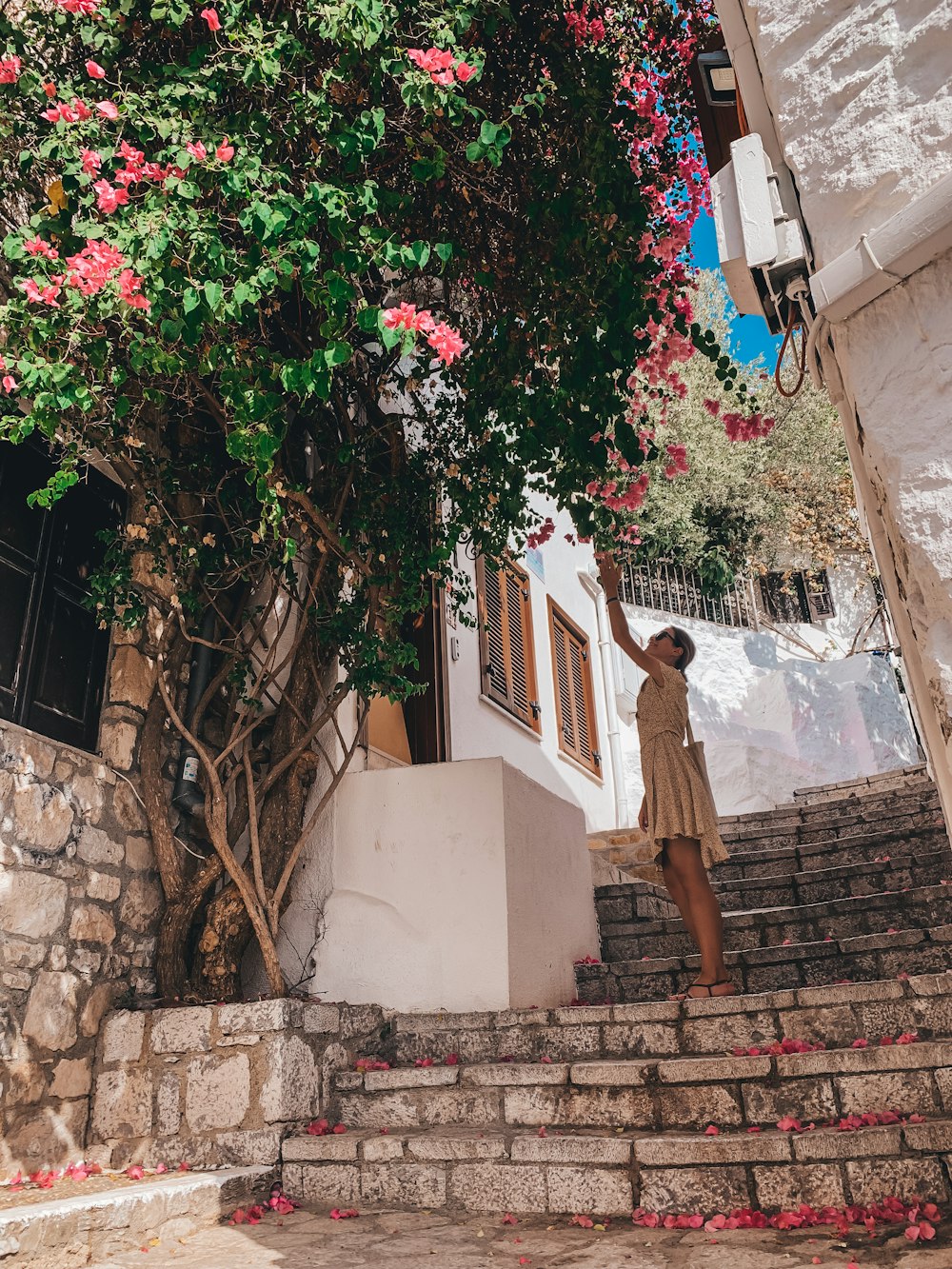 a person standing on a stone staircase