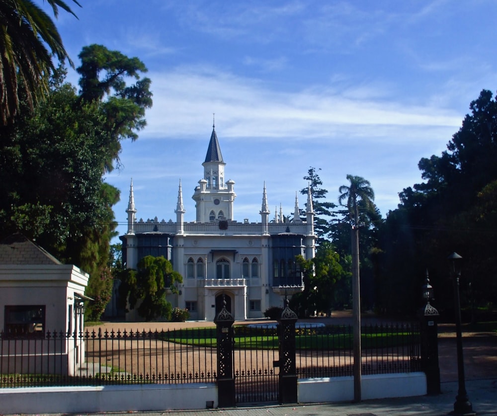 a white building with a fence around it