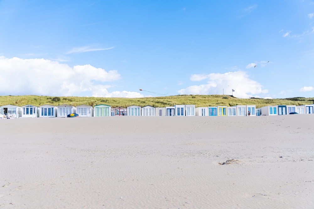 a beach with many blue and white buildings