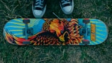 A sleek modern skateboard deck with vibrant graffiti art.