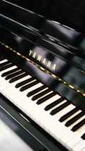 a yamaha piano with a black background