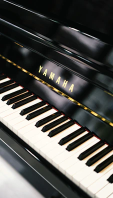 Yamaha branded keychains and small accessories arranged neatly on a wooden table.