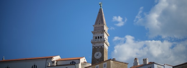 A clock tower on a building — Piran, Slovenia