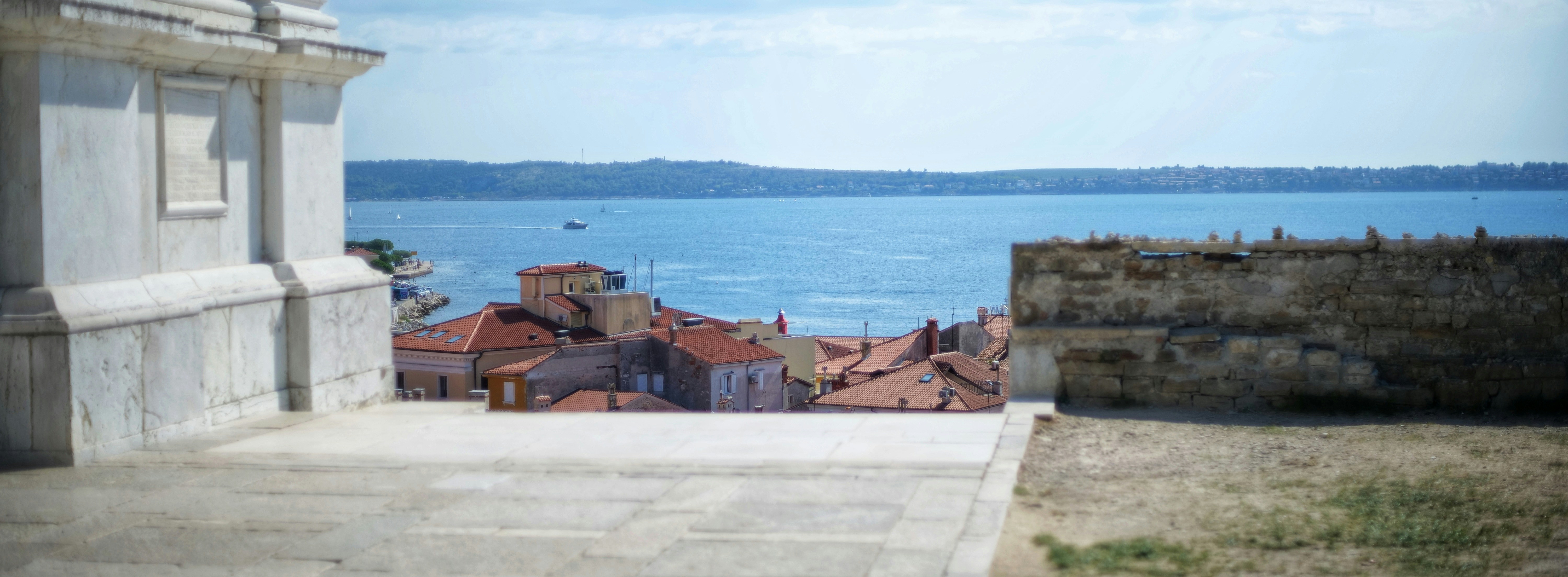 a group of buildings next to a body of water