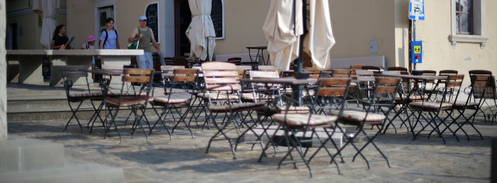 a group of tables and chairs outside