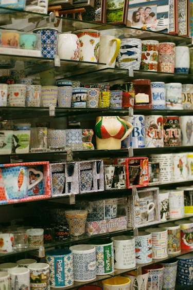 a shelf with many mugs on it