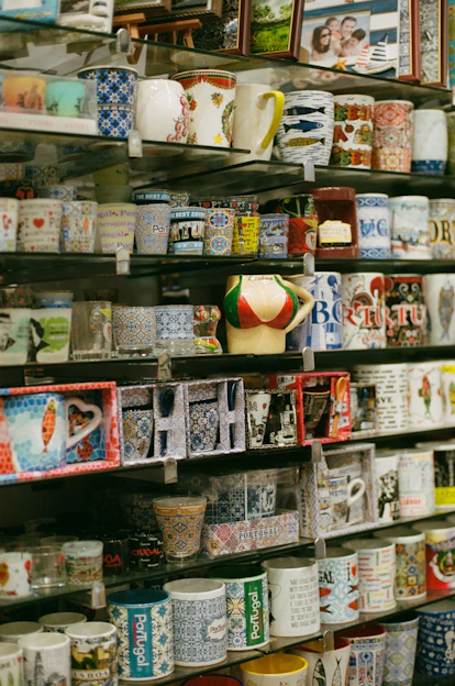 a shelf with many mugs on it