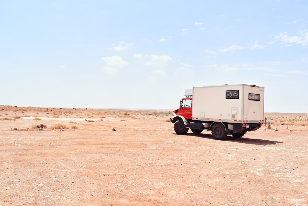 a truck driving on a dirt road