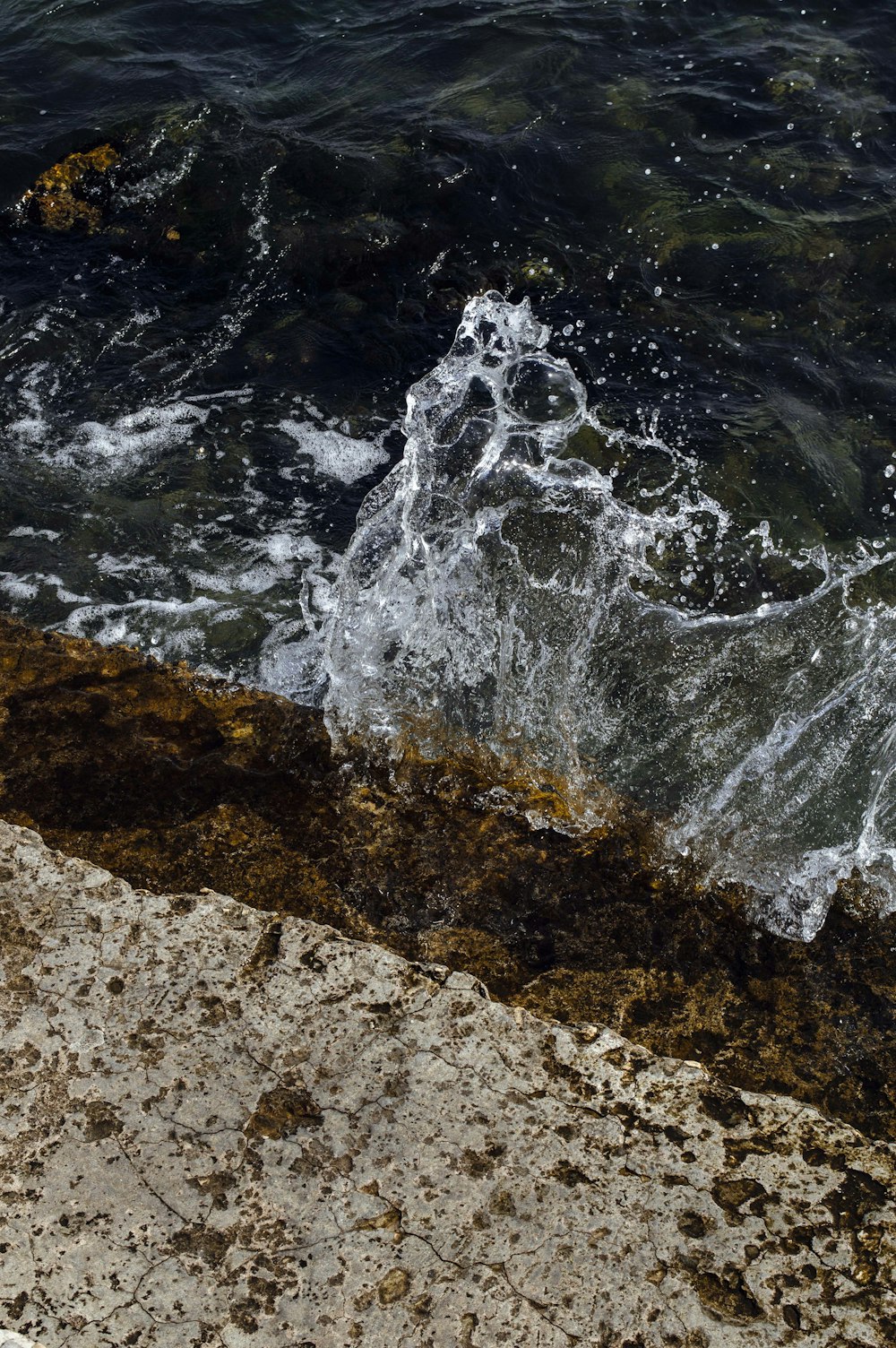 a wave crashing on a beach