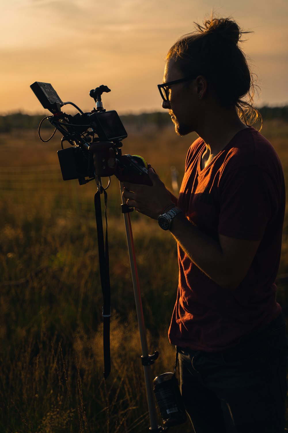 a man looking through a camera