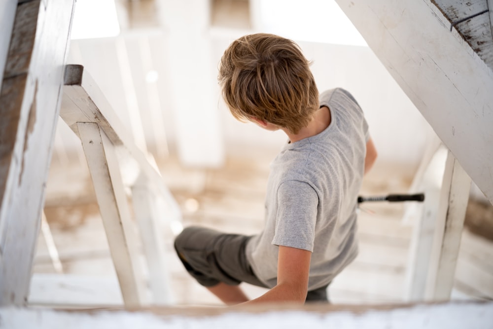 a child sitting on a staircase