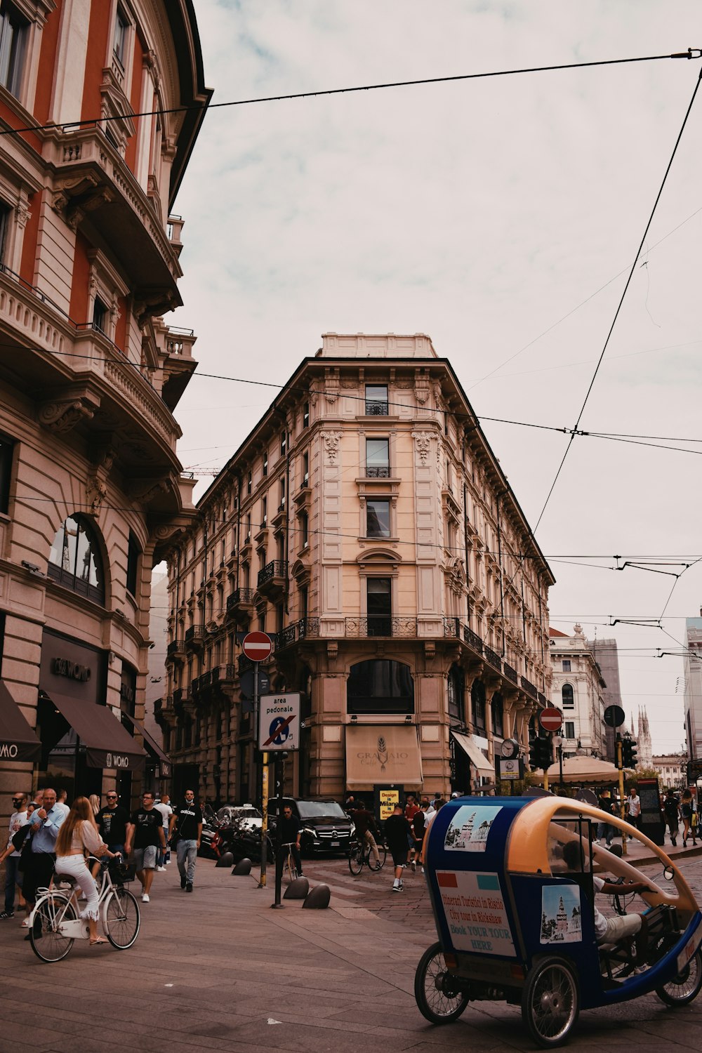 a street with buildings and people