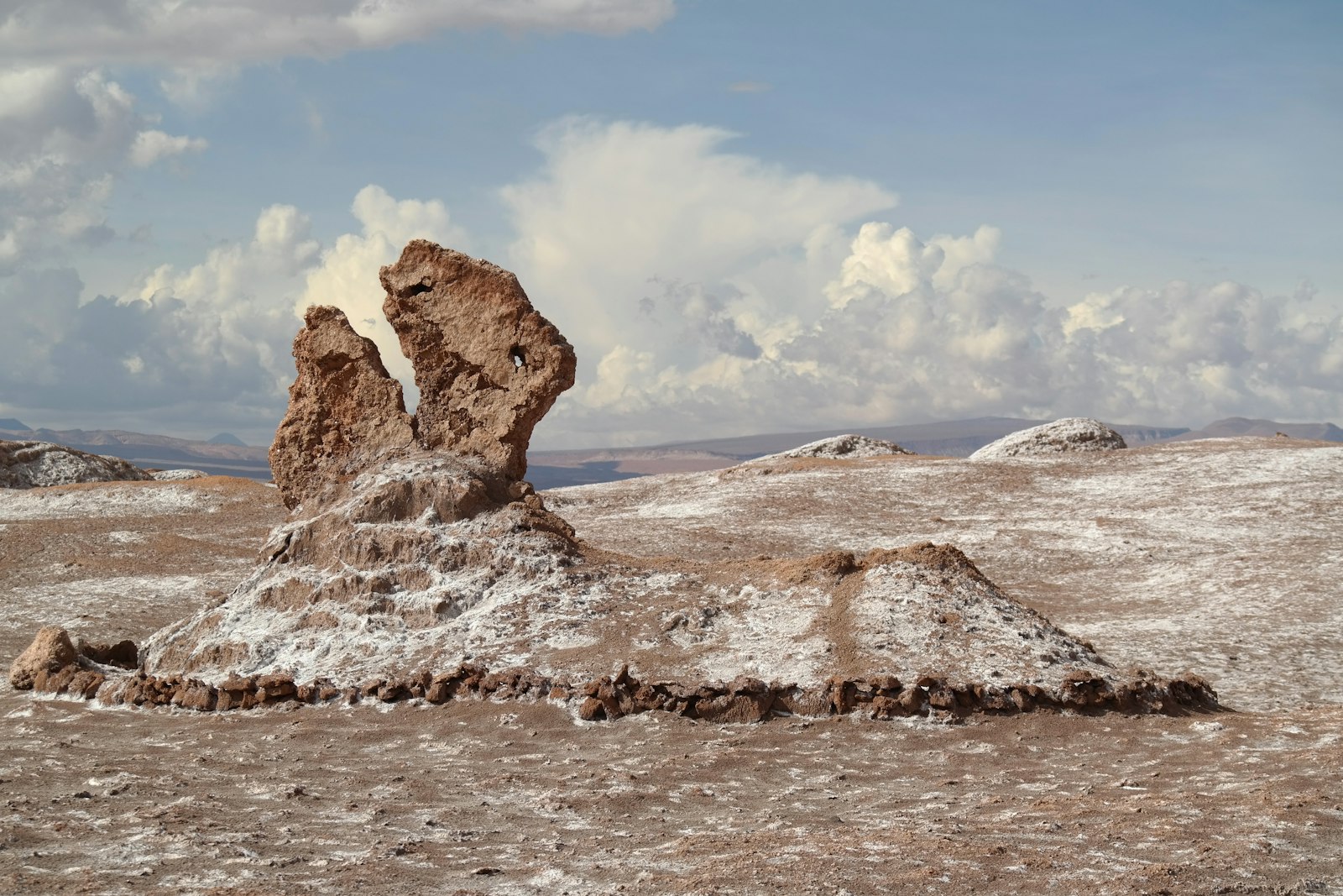 The wind-carved Tres Marías rock formation in the Valley of the Moon near San Pedro de Atacama