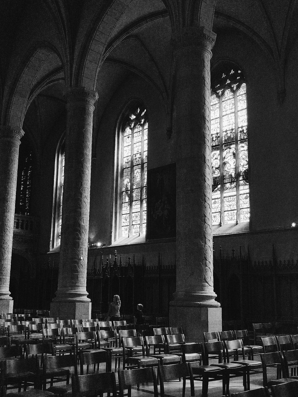 a large room with rows of chairs and a large window