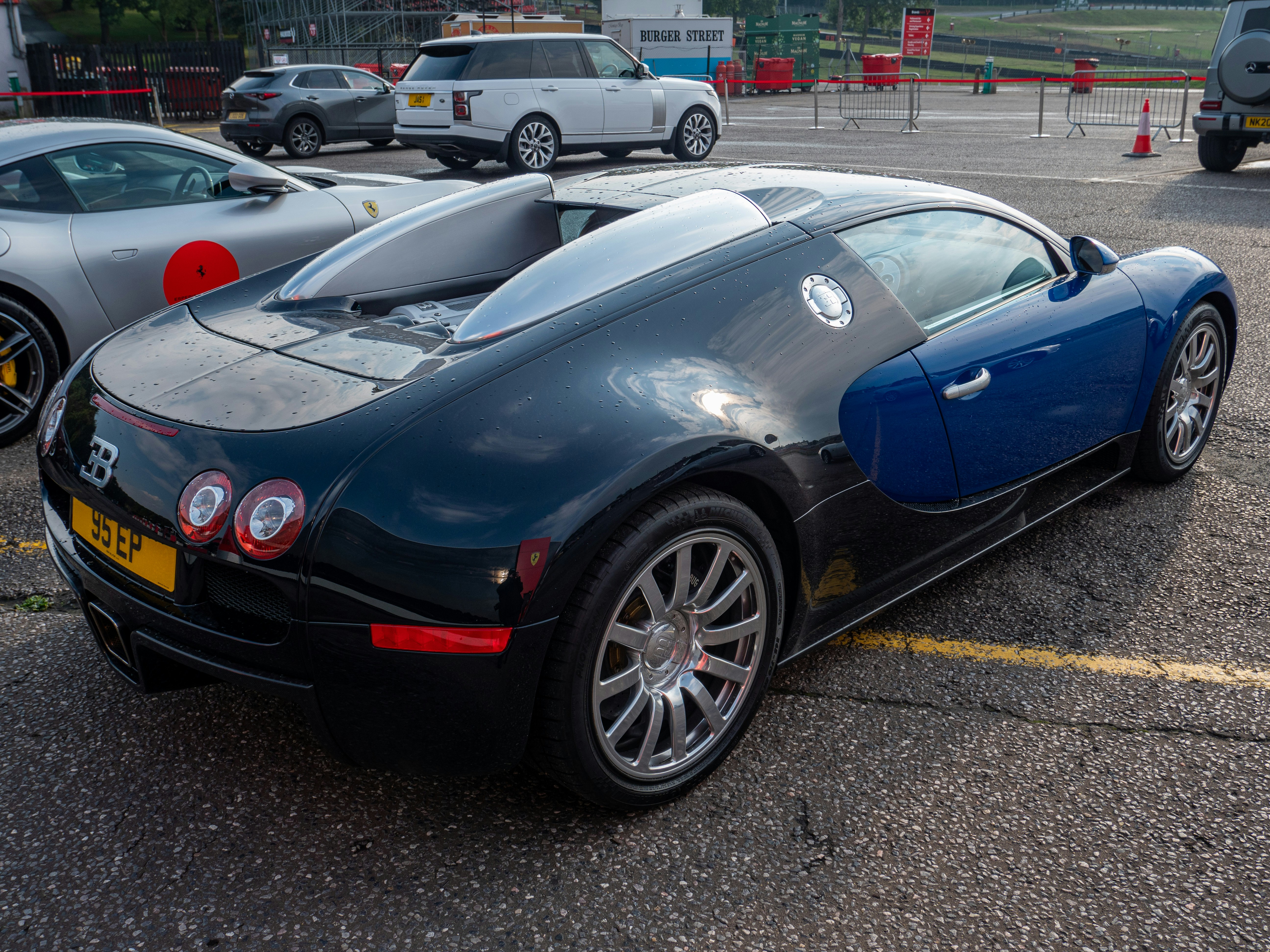 a black sports car parked in a parking lot