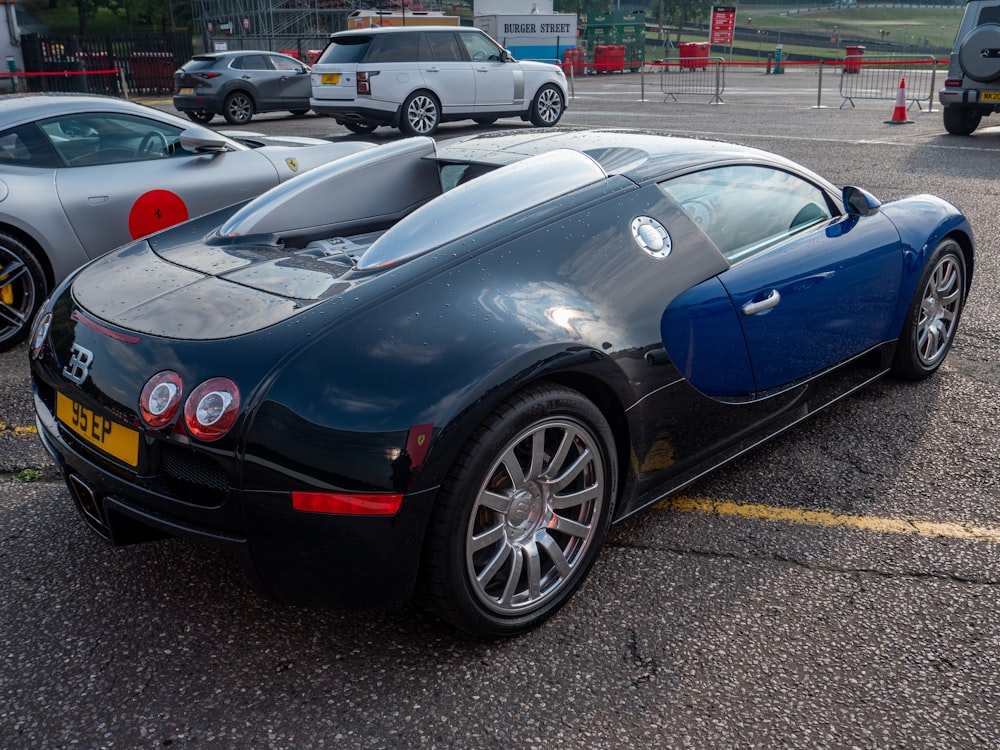 a black sports car parked in a parking lot