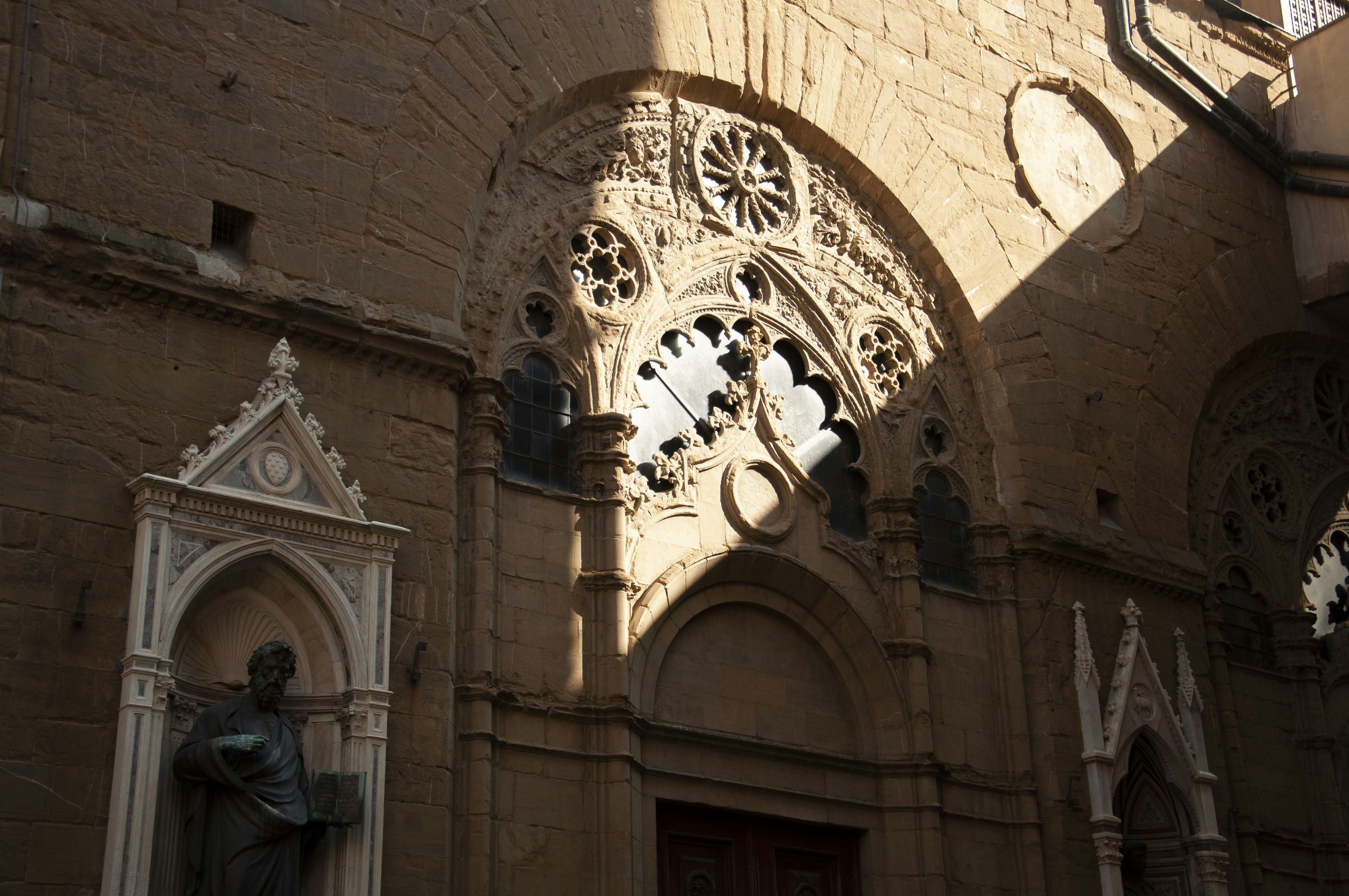 a statue in front of a building
