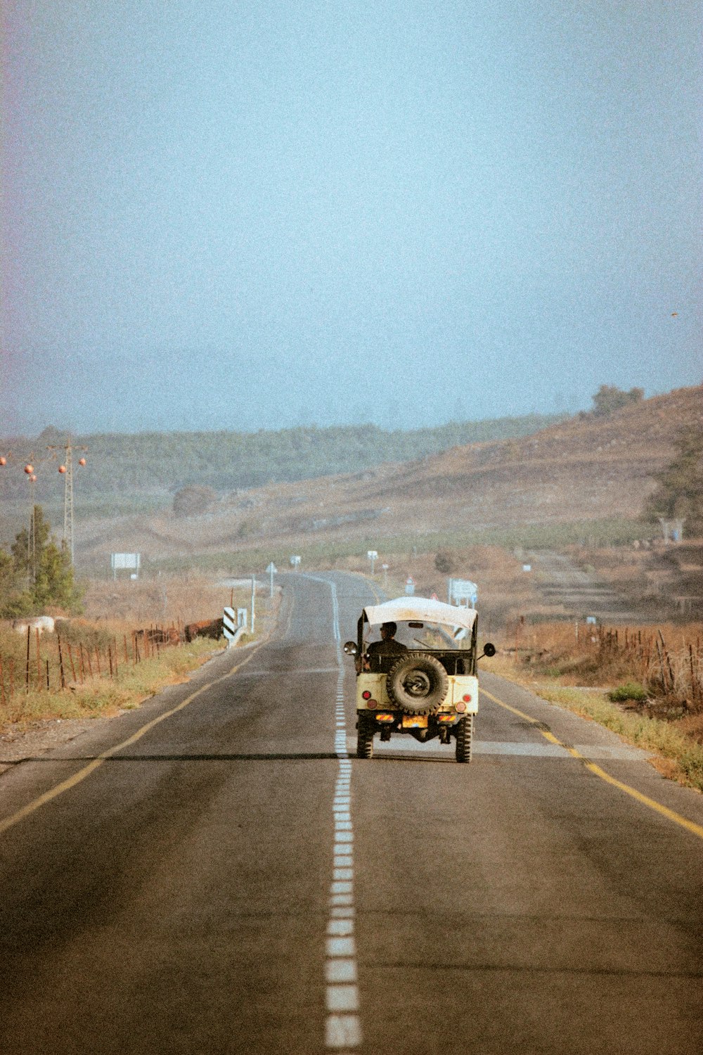 a truck driving down a road