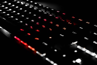 Interactive keyboard showing top and bottom rows lighting up during typing exercises.