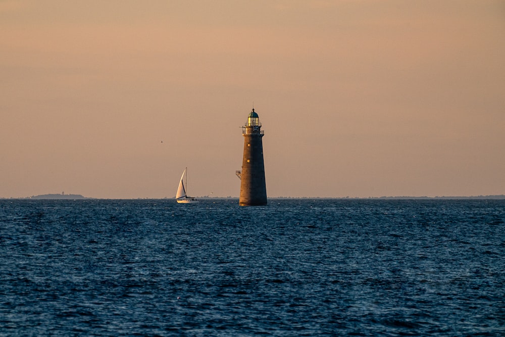 a lighthouse in the middle of the ocean