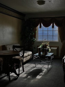 a room with a table and chairs
