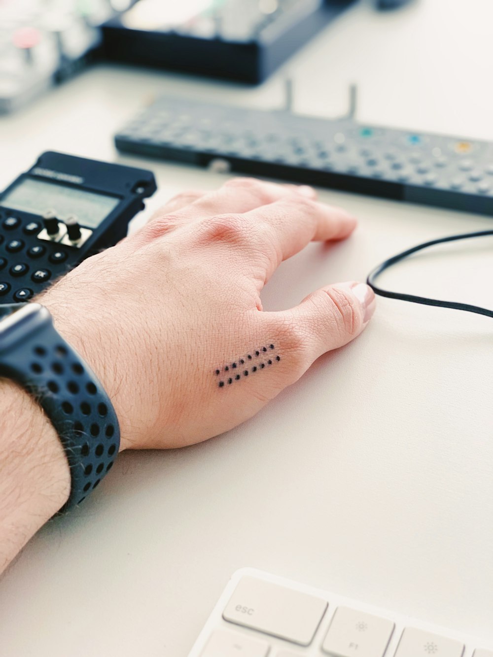 a person's hand with a tattoo on it