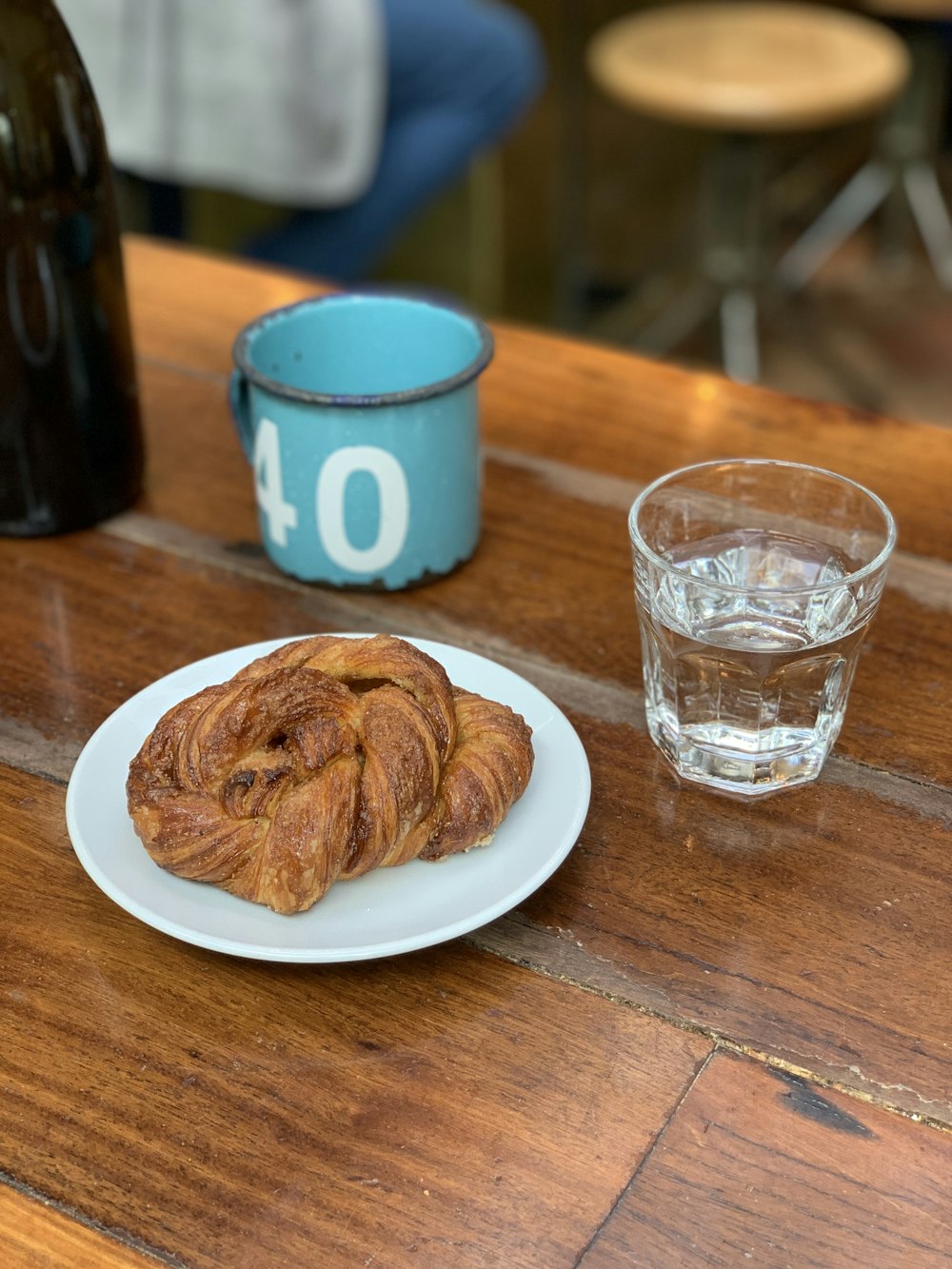 a plate of food and a glass of water on a table