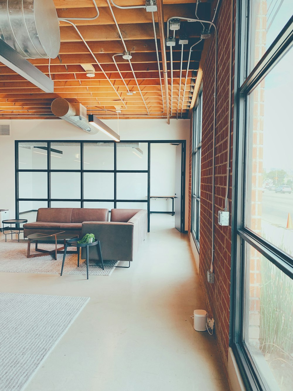 a room with a couch and chairs