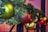 A close-up of colorful holiday ornaments and decorations on a festive table.