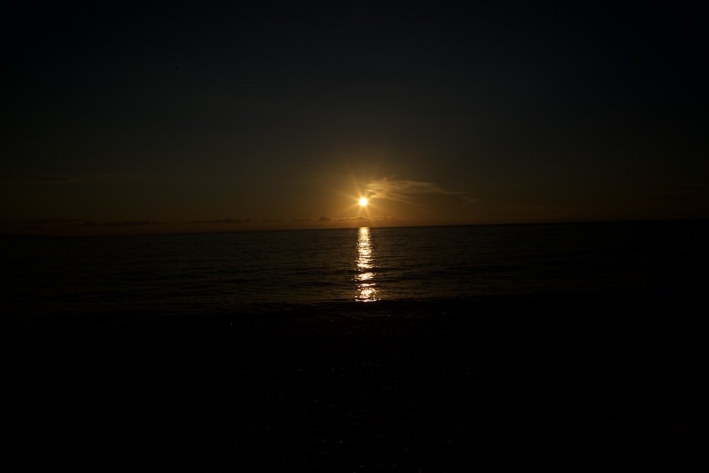 a sunset over a body of water