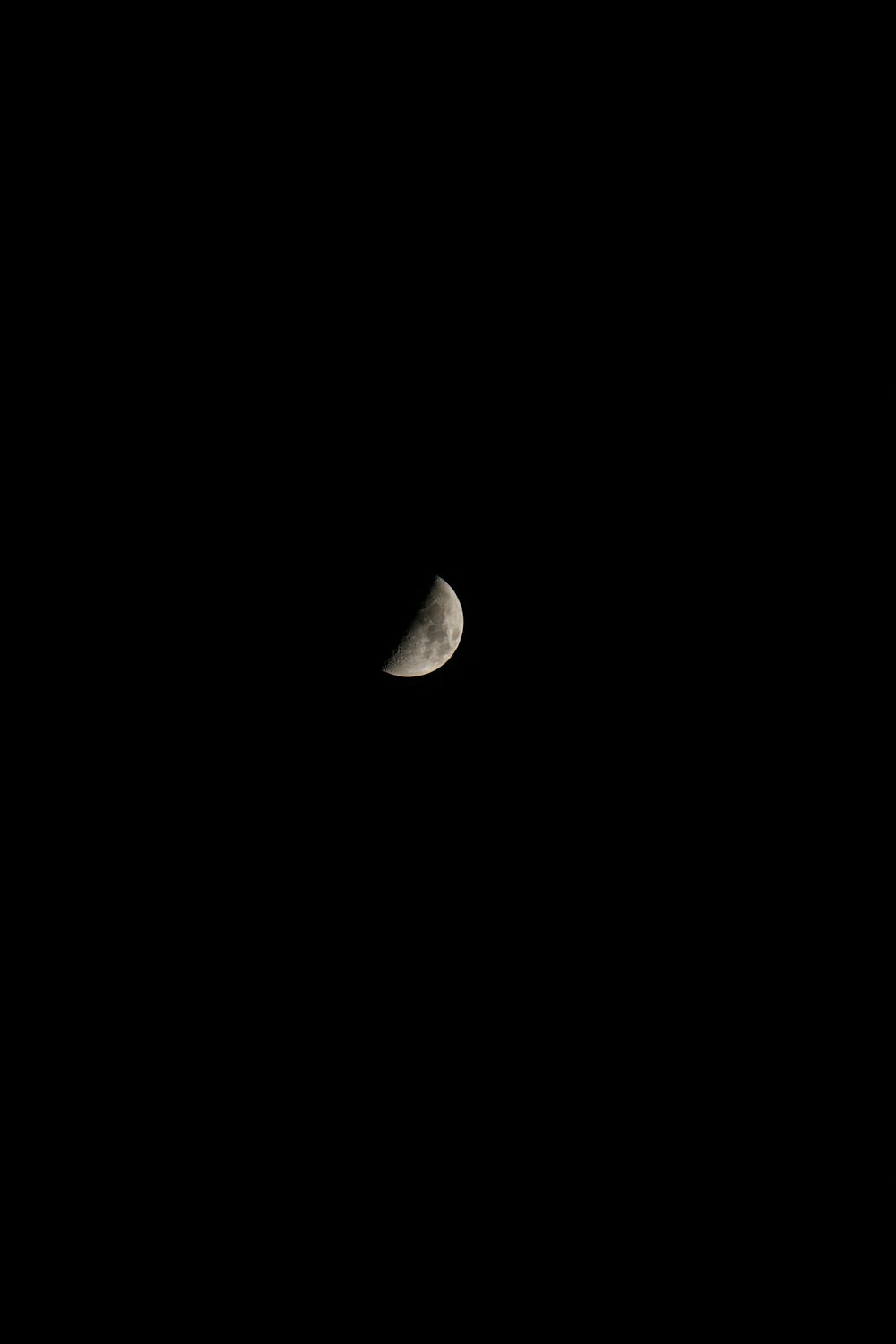 a crescent moon in a black sky