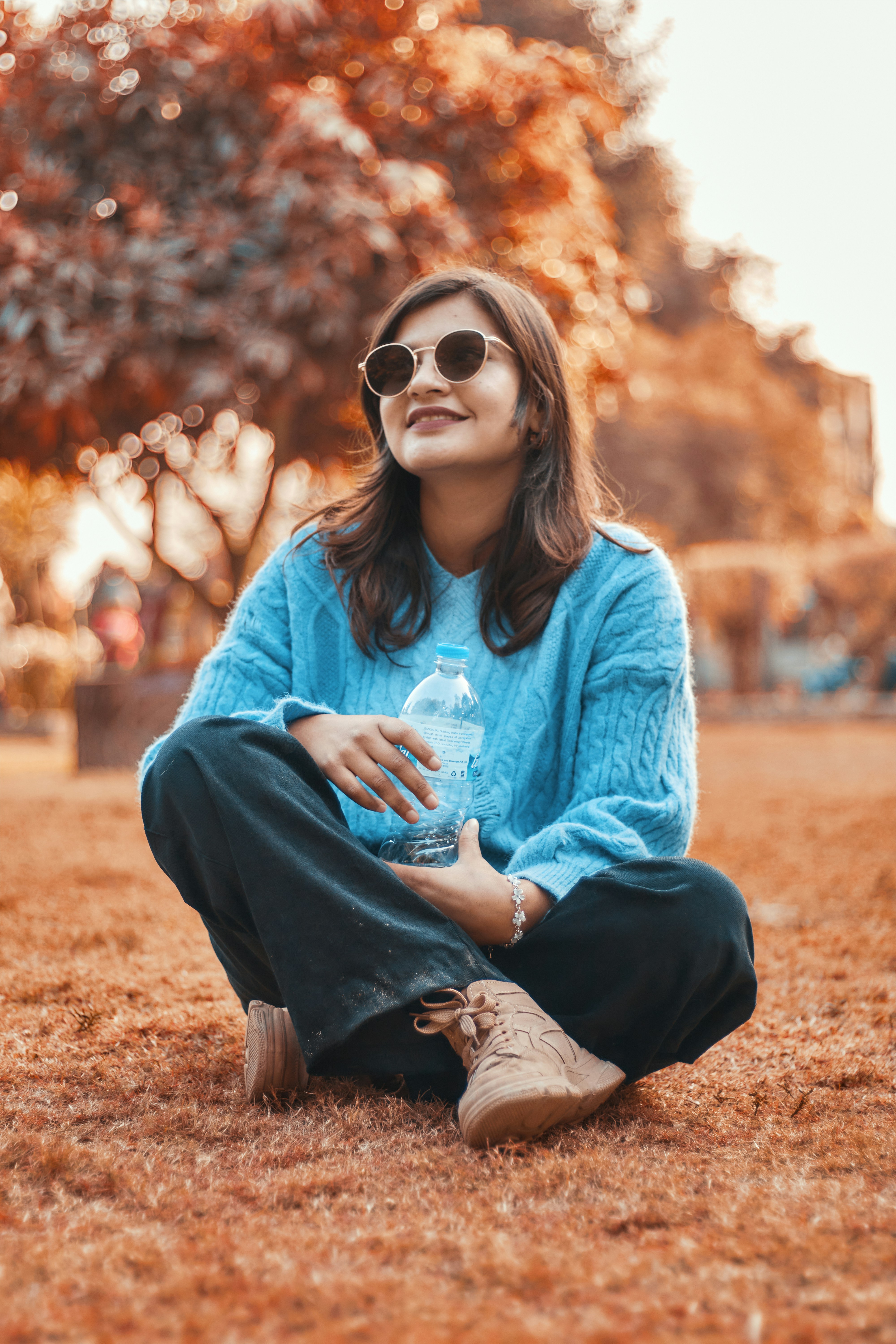 a woman sitting on the ground