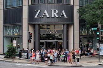 a group of people walking on the sidewalk