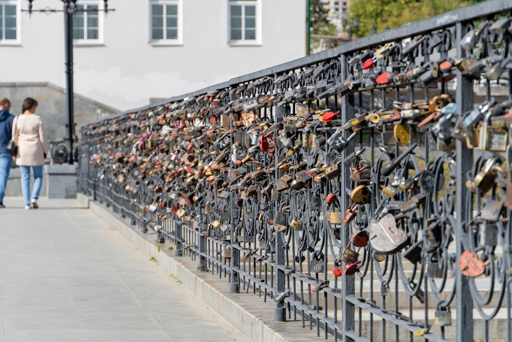 a large group of locks on a fence